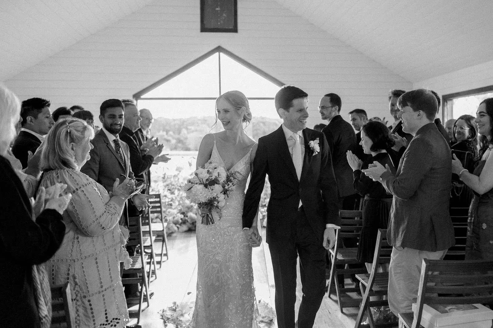 Wedding party celebrating together in black and white
